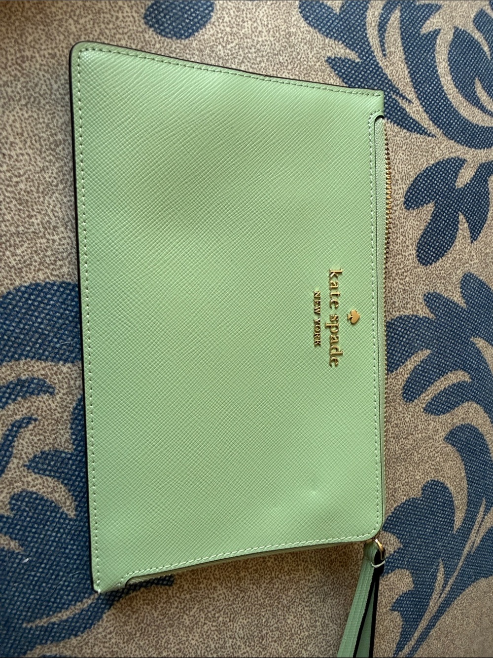 kate spade pastel mint Saffiano wristlet with gold logo